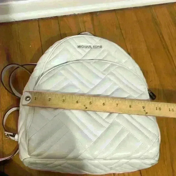 Michael Kors Abbey white quilted backpack. Silver hardware. Two zipper pockets. - Picture 11 of 12